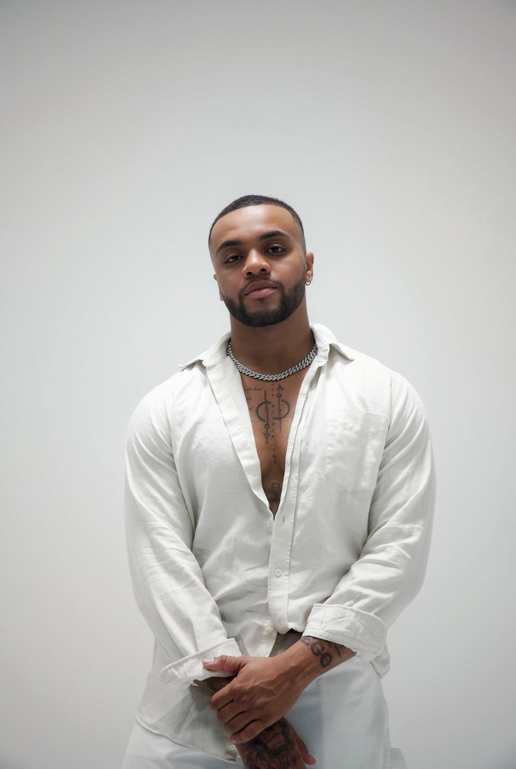 Lyle Bryant III in a white linen shirt